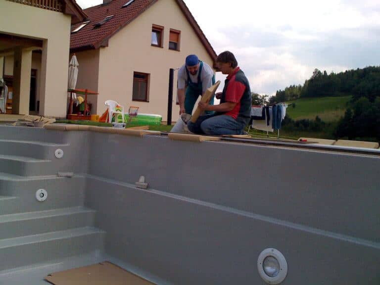 laying the ceramic edge of the pool