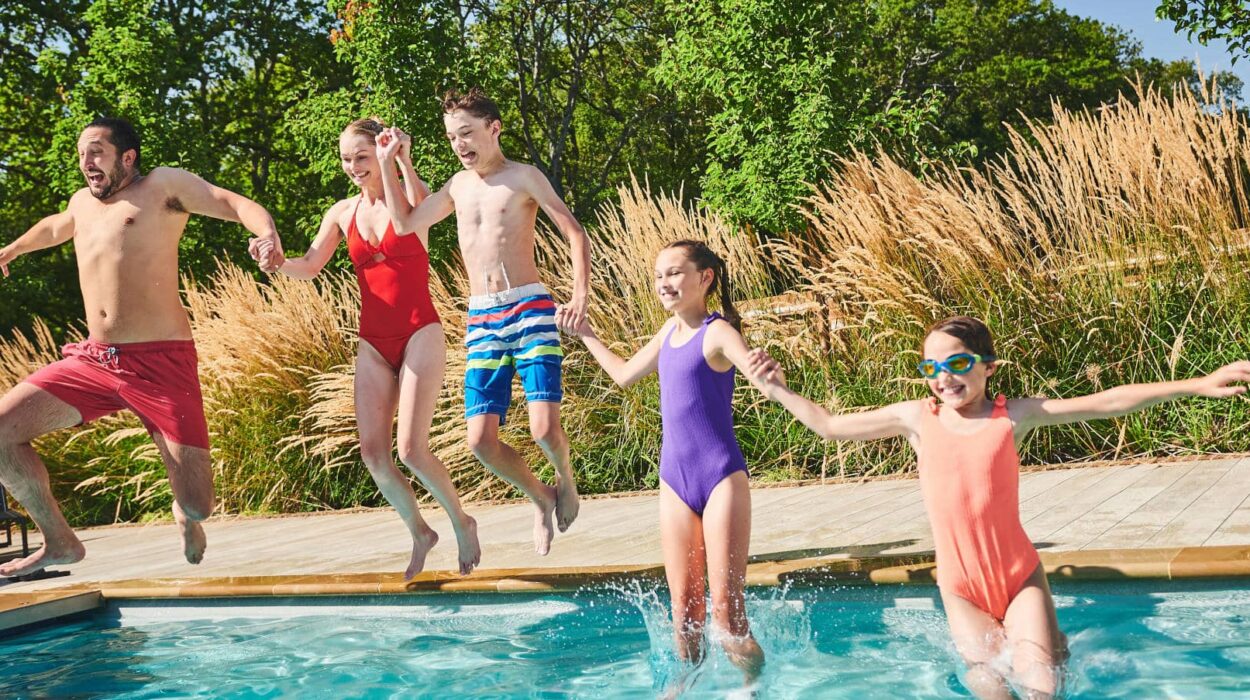 Family Jumping into the pool