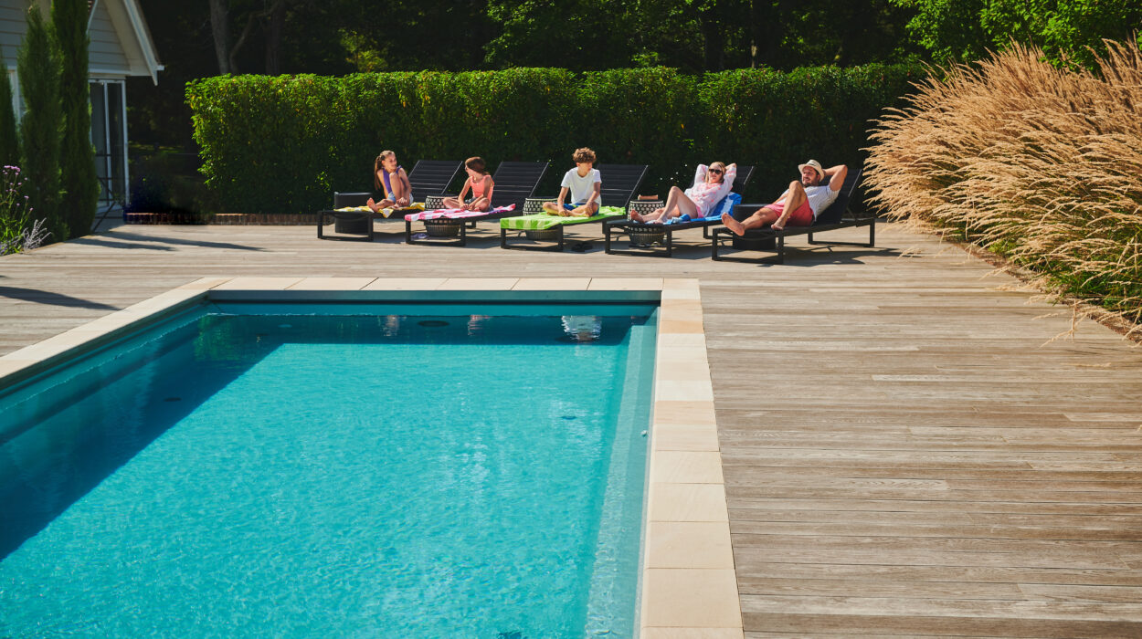 Family chilling out by the pool